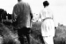 116795-T – Alexander Graham Bell and Mabel Hubbard Bell walking away from the camera at Beinn Bhr